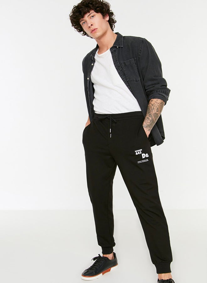 trendyol Black Regular Cut Elastic Leg Lace Up Text Printed Sweatpants TMNSS22EA0150 - Image 2