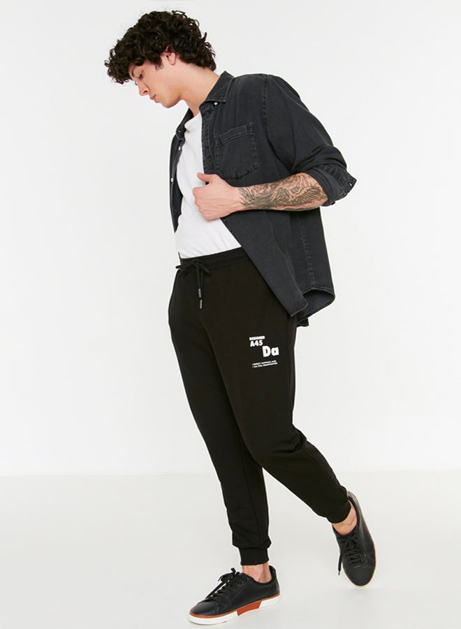 trendyol Black Regular Cut Elastic Leg Lace Up Text Printed Sweatpants TMNSS22EA0150 - Image 1