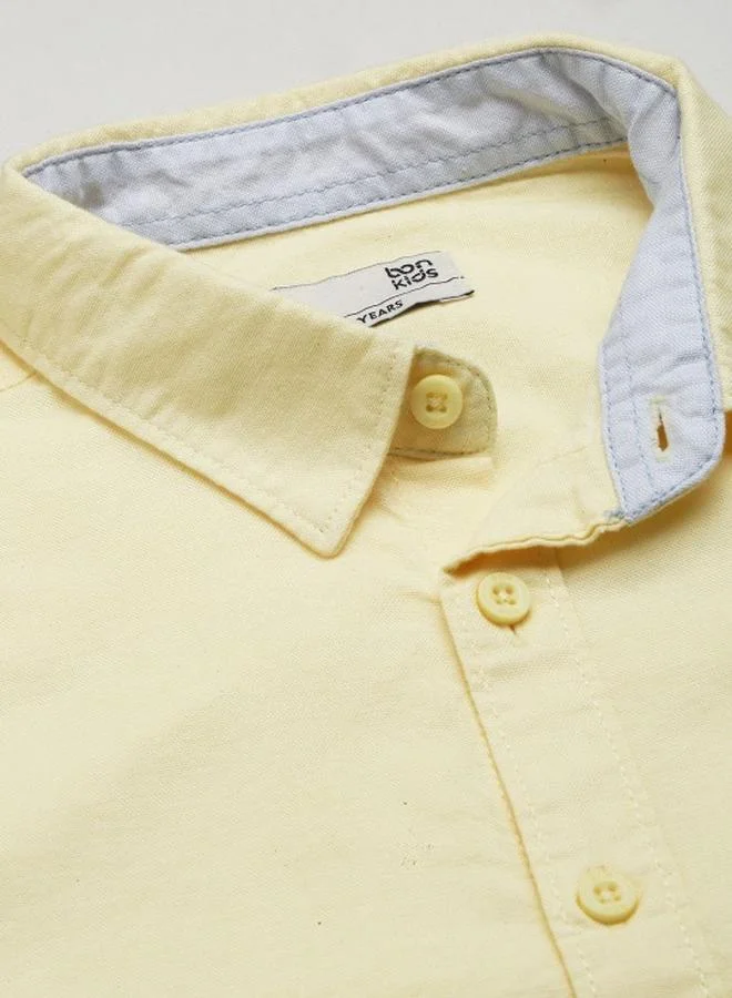 Bonkids Boy's shirts in regular fit yellow colour cotton fabric embellished pattern pull over closure woven weave type round collar type round neckline half sleeve length button down upper body wear type suitable for casual occasions – because standout style starts young!