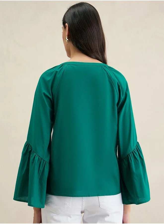 فيميلا Solid Cotton Bell Sleeves Notch Neck Top by Styli