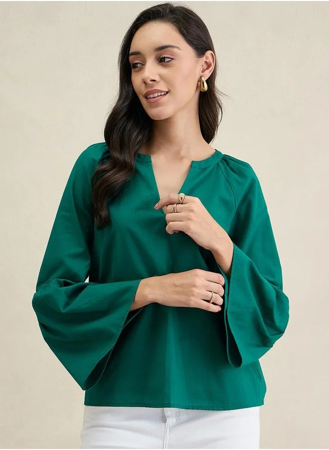 فيميلا Solid Cotton Bell Sleeves Notch Neck Top by Styli