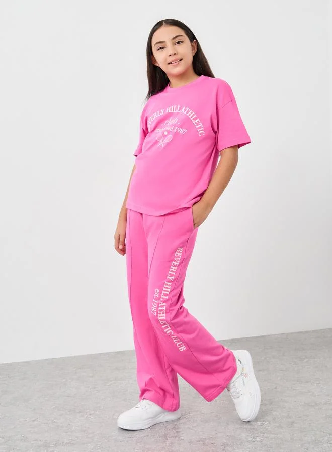 ستايلي Styli Beverly Hills Print Oversized T-Shirt and Joggers Set