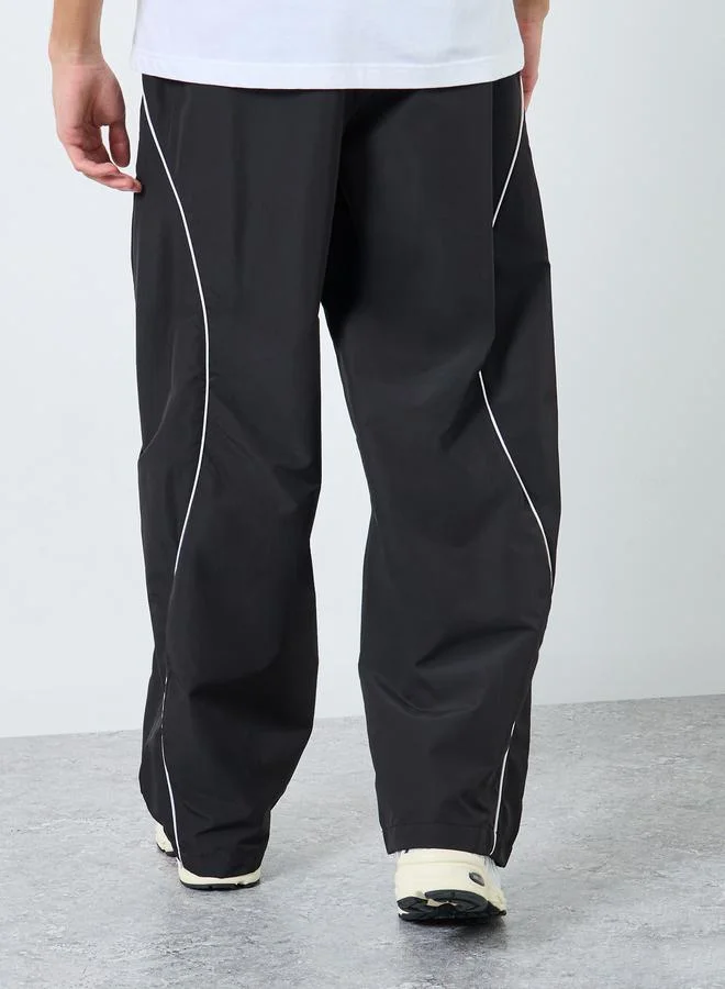Styli Cut and Sew Panel with Reflection Piping Joggers