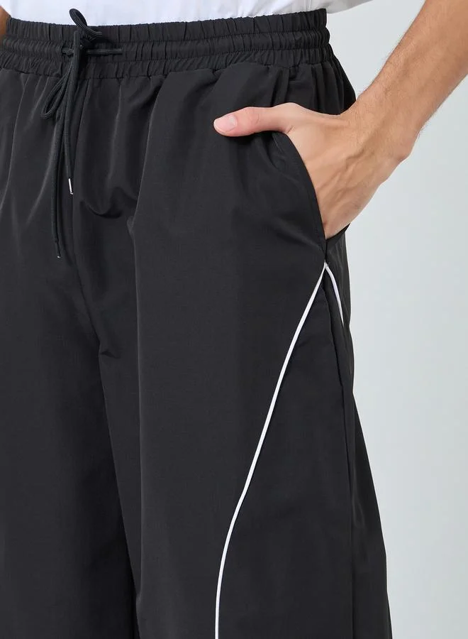 Styli Cut and Sew Panel with Reflection Piping Joggers