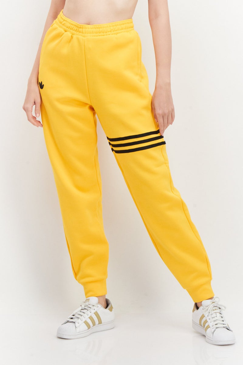 adidas Originals Women Sportswear Fit Outdoor Jogger Pants, Collegiate Gold  - Image 1