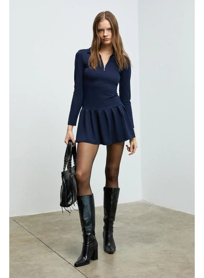 Grimelange ISANDRIA Women's polo‑collared dress with front zipper detail, long sleeves, waist‑fitted, pleated mini navy dress.