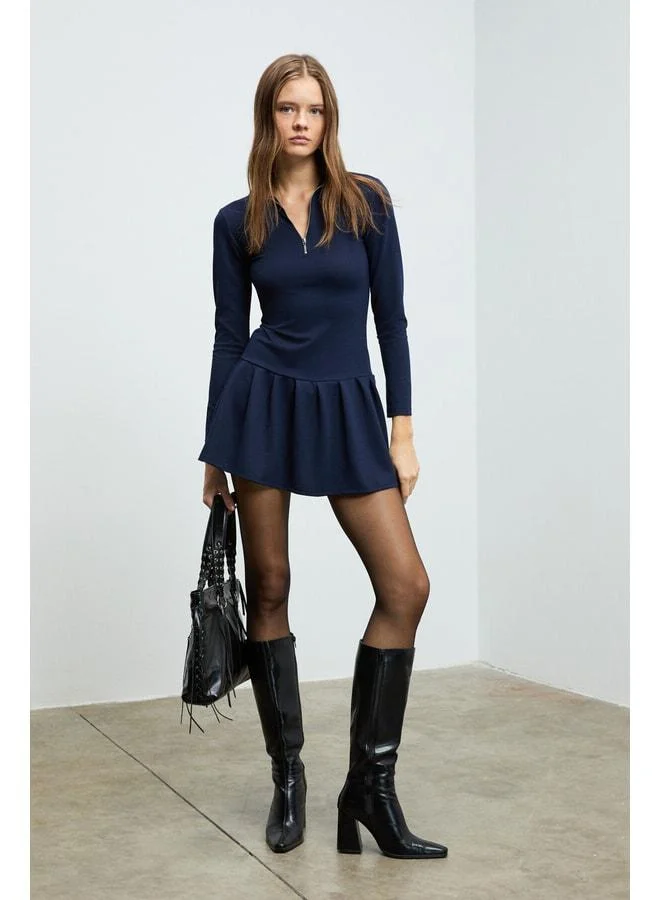 Grimelange ISANDRIA Women's polo‑collared dress with front zipper detail, long sleeves, waist‑fitted, pleated mini navy dress.