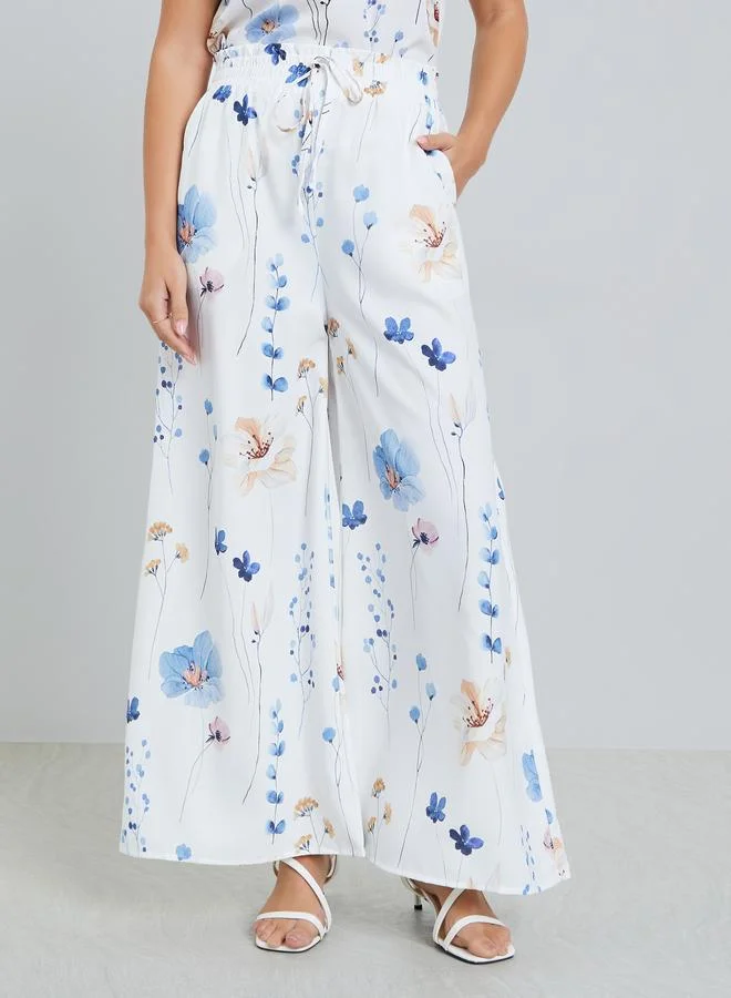 تايك تو بنطال بأرجل واسعة وطبعة زهور