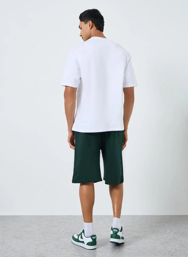 Styli  Men Minimal Print Oversized T-Shirt and Shorts Co-Ords for Men | Best Price UAE