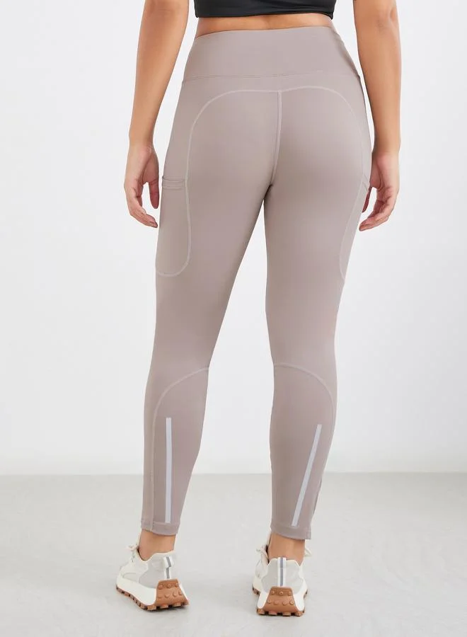 Styli Styli Gymspire Edition - Calf Reflective Striped Pocket Detail Leggings