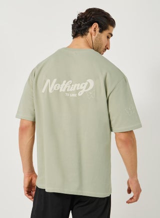 Slogan Print Terry Oversized T-Shirt - pzsku/ZBC015A31CCEC40E59AFFZ/45/_/1738970583/f9ff09d9-8ea3-4ac9-9049-b5a5068d8ab7