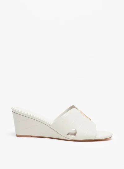 فلورا بيلا من شو إكسبرس Women's Textured Slip-On Sandals With Wedge Heels