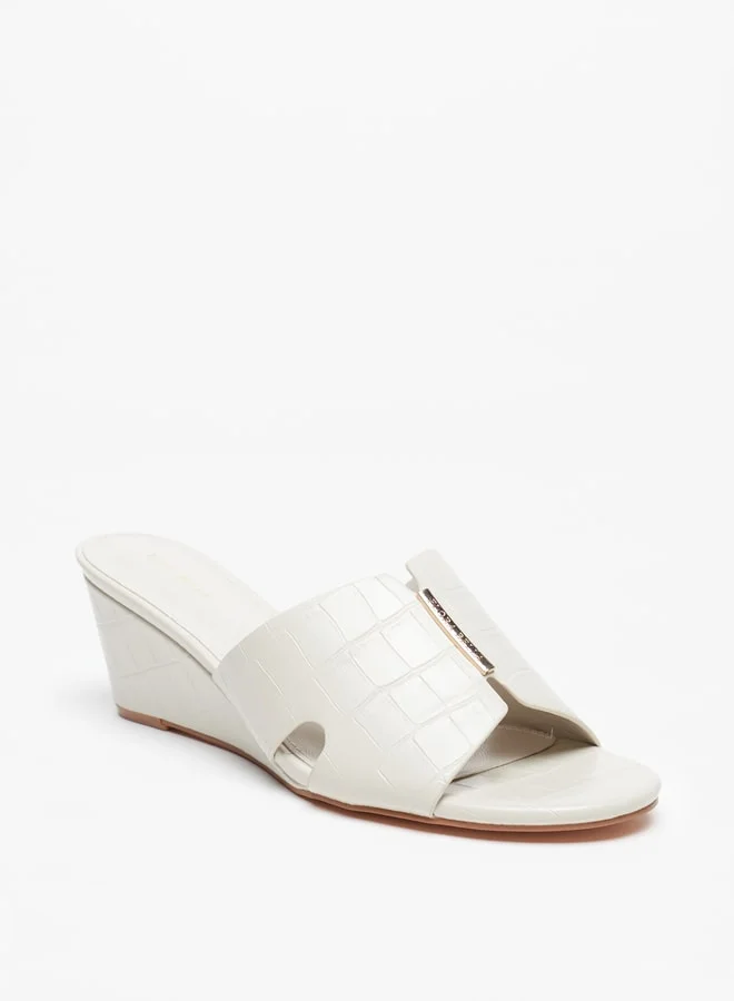 فلورا بيلا من شو إكسبرس Women's Textured Slip-On Sandals With Wedge Heels