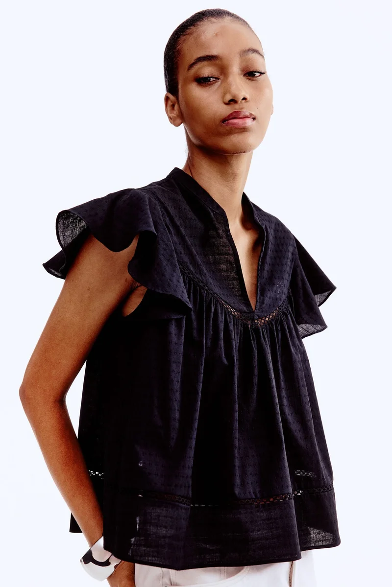 اتش اند ام بلوزة محبوكة من نسيج دوبي