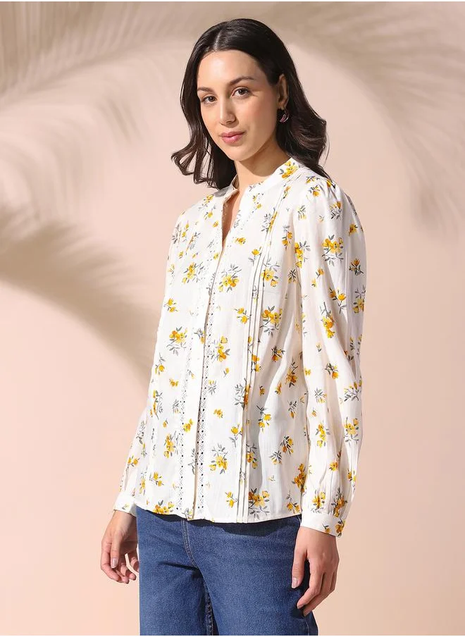 دينيس لينغو Women white regular fit printed full sleeves t-shirt viscose blend top with button closure featuring a mandarin collar- tailored to elevate your everyday.