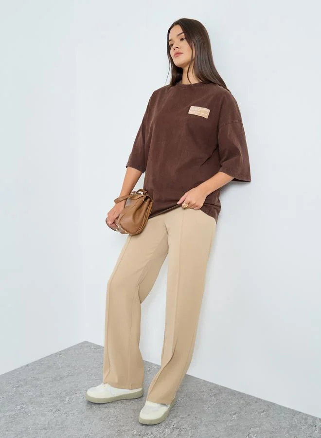 Styli Styli Brown Oversized Washed T-Shirt with Badge Detail