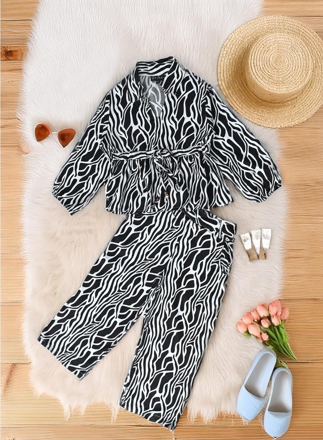 بيلا مودا طقم منسق من بنطال وبلوزة مطبعة بالكامل - Image 1