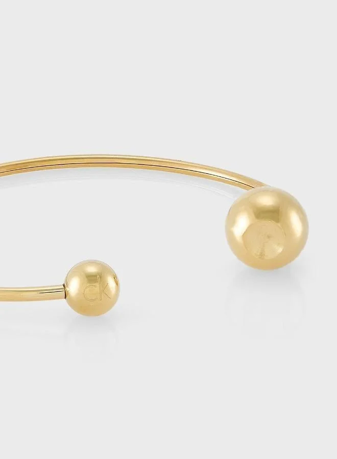 Calvin Klein  Sculptural Bubbles Collection Open Bangle Bracelet For Women In Yellow Gold - 35000787 for Women | Best Price UAE