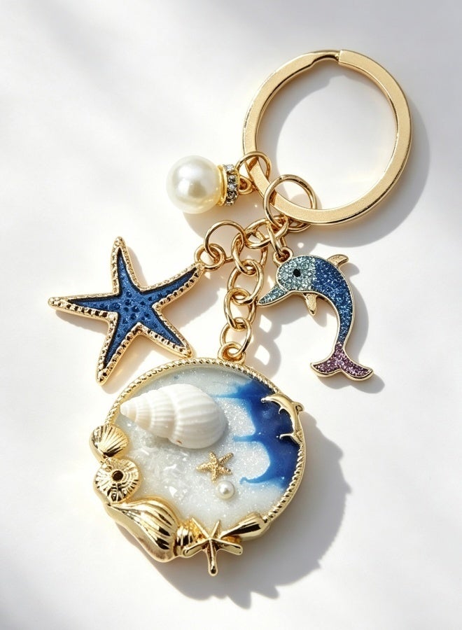 Nautical Ocean Themed Keychain Glitter Dolphin Starfish Seashell Pearl Charms Gold Metal Ring Bag Pendant Gift for Women Girls - Image 1