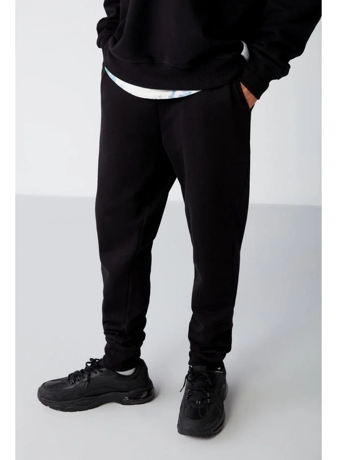 GRIMELANGE Jeremiah Men's Regular Fit Pants with Stretch Fabric, Waist Drawstring, and Elastic Pocket, Black Sweatpants.
