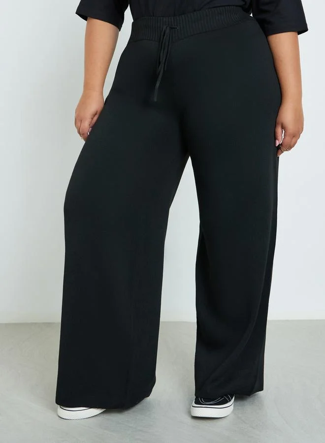 Styli Styli Plus Size Flat Knit Wide Leg Trousers