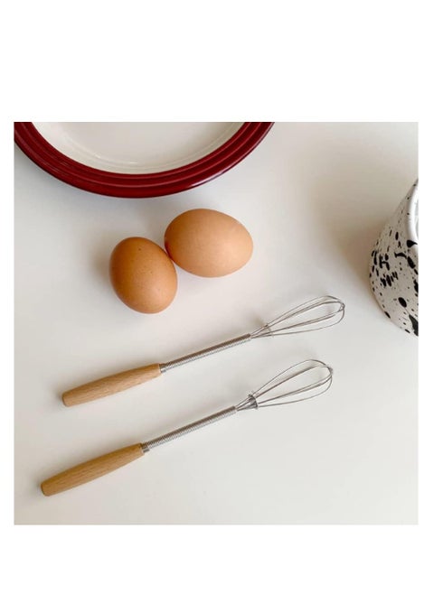 Small whisk with wooden handle for whisking, beating, blending ingredients and mixing sauces