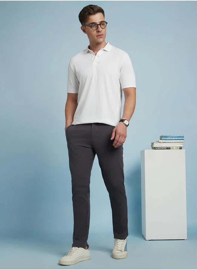 Dennis Lingo Sleek Steel Grey Slim Fit Chinos for Men featuring a mid-rise design, crafted from a durable 98% cotton and 2% lycra blend for flexibility and comfort.