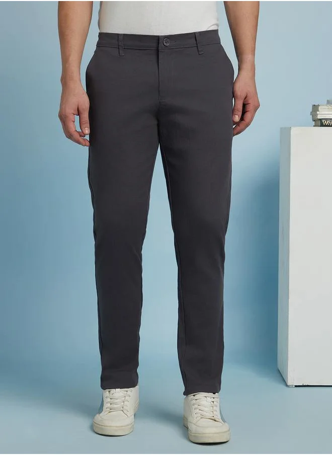 دينيس لينغو Sleek Steel Grey Slim Fit Chinos for Men featuring a mid-rise design, crafted from a durable 98% cotton and 2% lycra blend for flexibility and comfort.