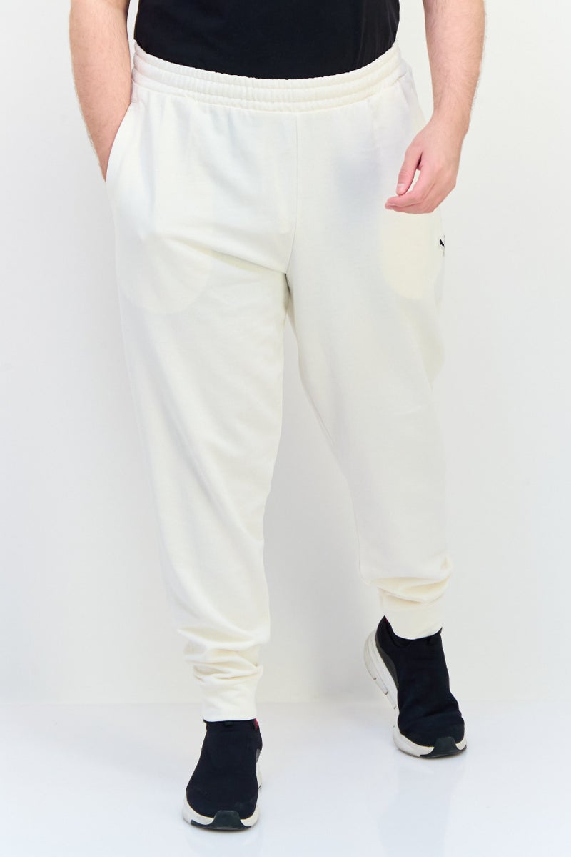 PUMA Men Sportswear Fit Outdoor Sweatpants, Cream - Image 1