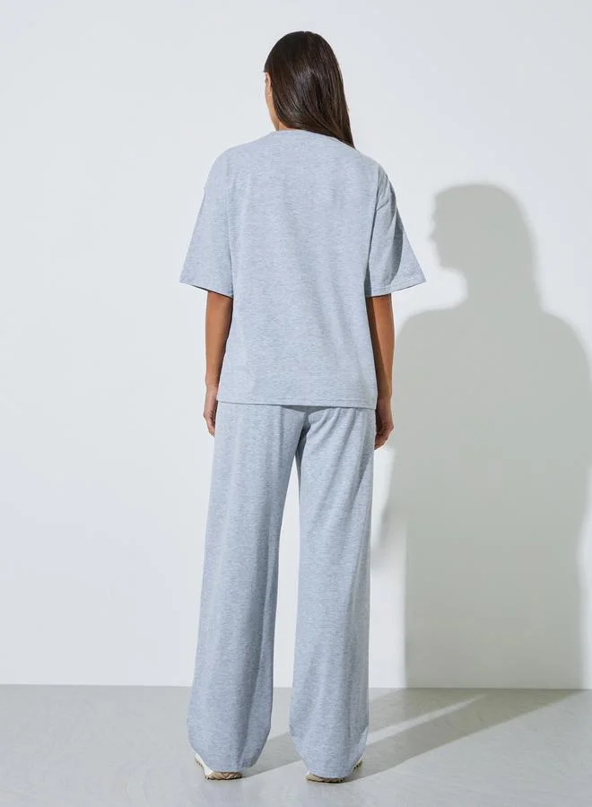 Styli  Grey Relaxed Fit T-Shirt and Wide Leg Joggers Co-ord Set for Women | Best Price UAE