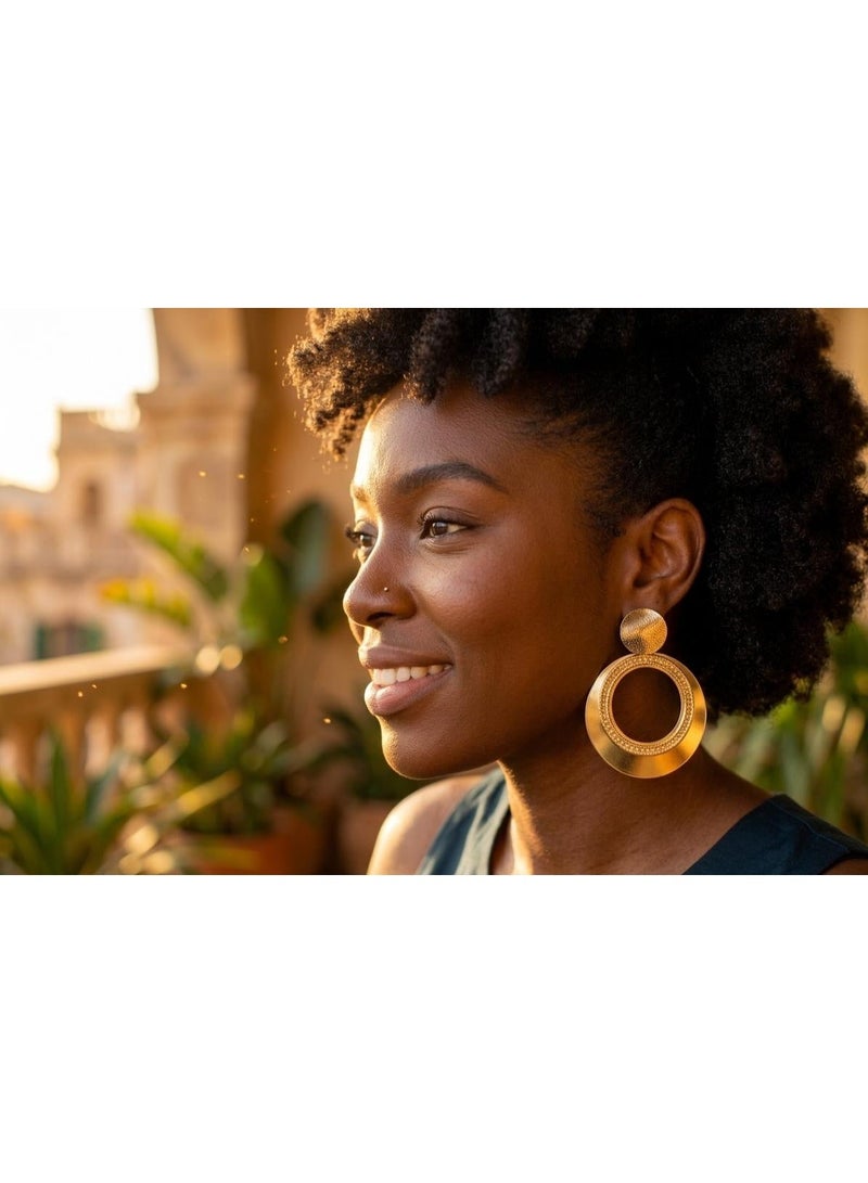 Luxuria These earrings feature a geometric design that combines a narrow top disc and a large circular hoop with engraved or etched details, giving them a classic yet modern touch. - Image 2