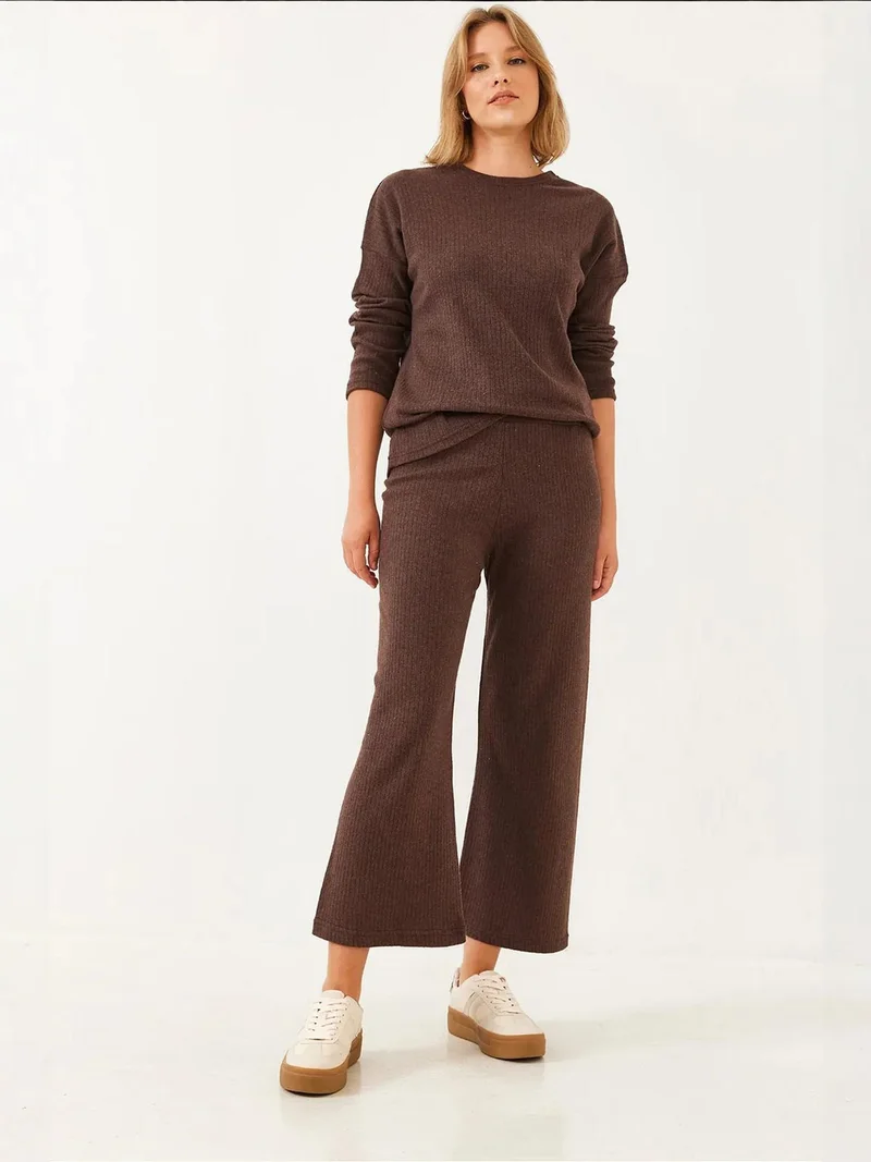 بيانكو لوتشي طقم سترة وسروال بياقة دائرية بنقشة مضلعة من لوتشي