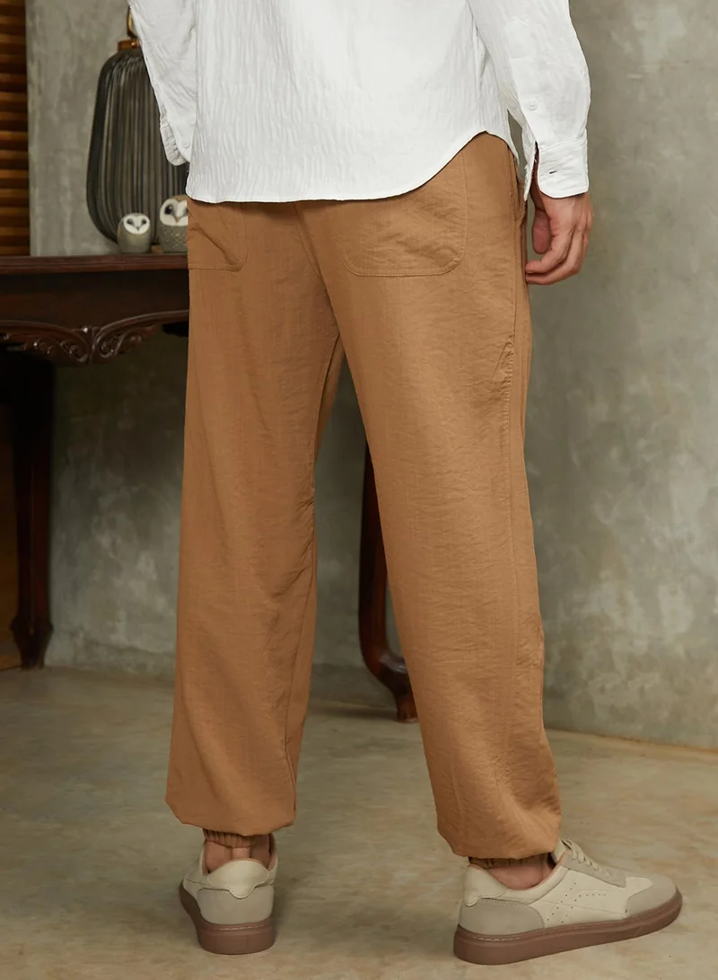 Campus Sutra  Men's Obsidian Black Solid Belted Cargo Pants For Casual Wear | Mid-Rise | Regular Fit | Elasticated Waist Closure | Cargo Pants Crafted With Comfort Fit For Everyday Wear for Men | Best Price UAE