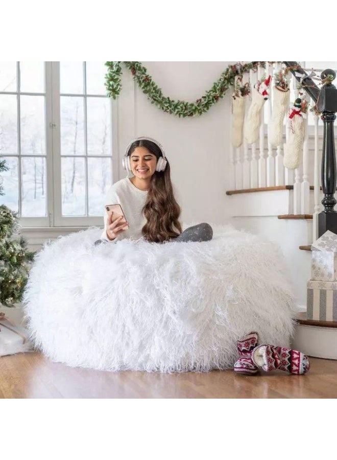 The elegant fur pouf combines maximum comfort with a luxurious look, making it a perfect addition to any home. White.