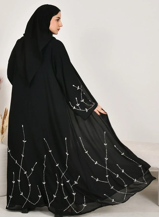 HAWRAA ABAYA Black wrap abaya adorned with elegant white embellishments