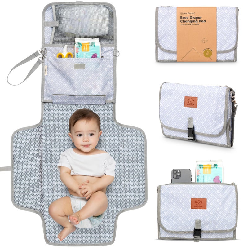 KeaBabies Portable Diaper Changing Pad - Large Waterproof Baby Changing Mat, Compact Travel Diaper Clutch, Functional Pockets Fit Newborn Essentials, Wipeable & Padded Baby Changer (Gray Mod) - Image 1