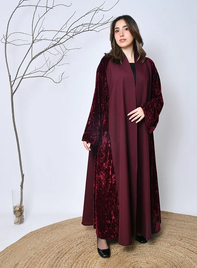 عبايات حوراء عباية شتوية خمرية مخملية فاخرة – تصميم راقٍ من عبايات حوراء