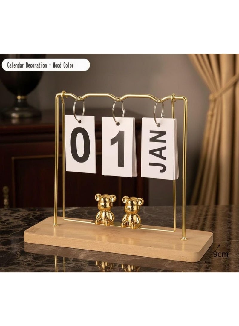 Desk calendar with teddy bear swing design, finished in gold. A charming and practical stationery accessory suitable for both office and home use. - Image 1