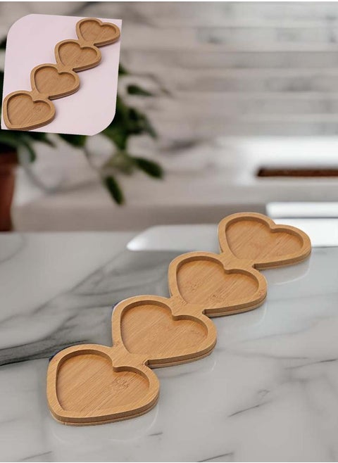 Wooden plate for serving nuts in the shape of hearts