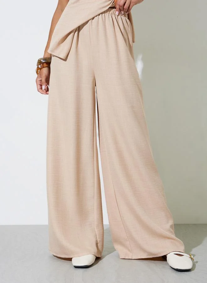 Styli  Beige Textured Sleeveless Blouse and Wide Leg Trousers Co-Ord Set for Women | Best Price UAE