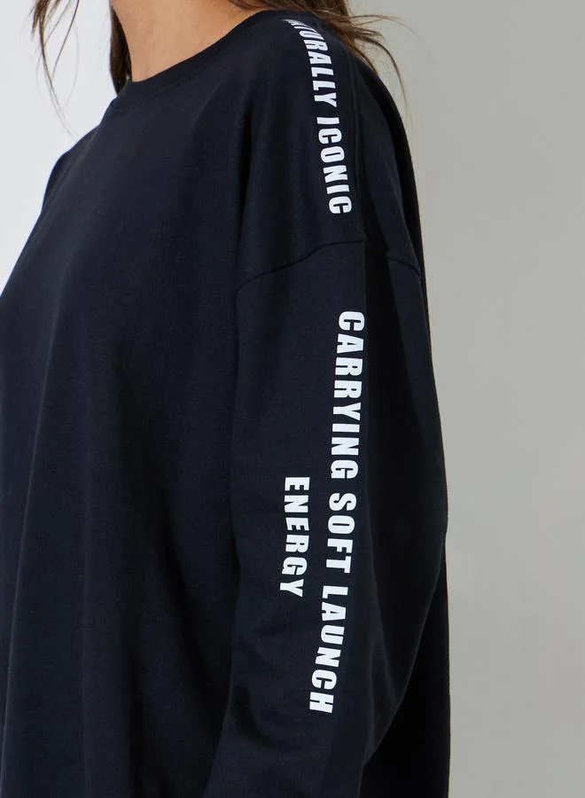 Styli  Black Longline Slogan Sweatshirt for Women | Best Price UAE