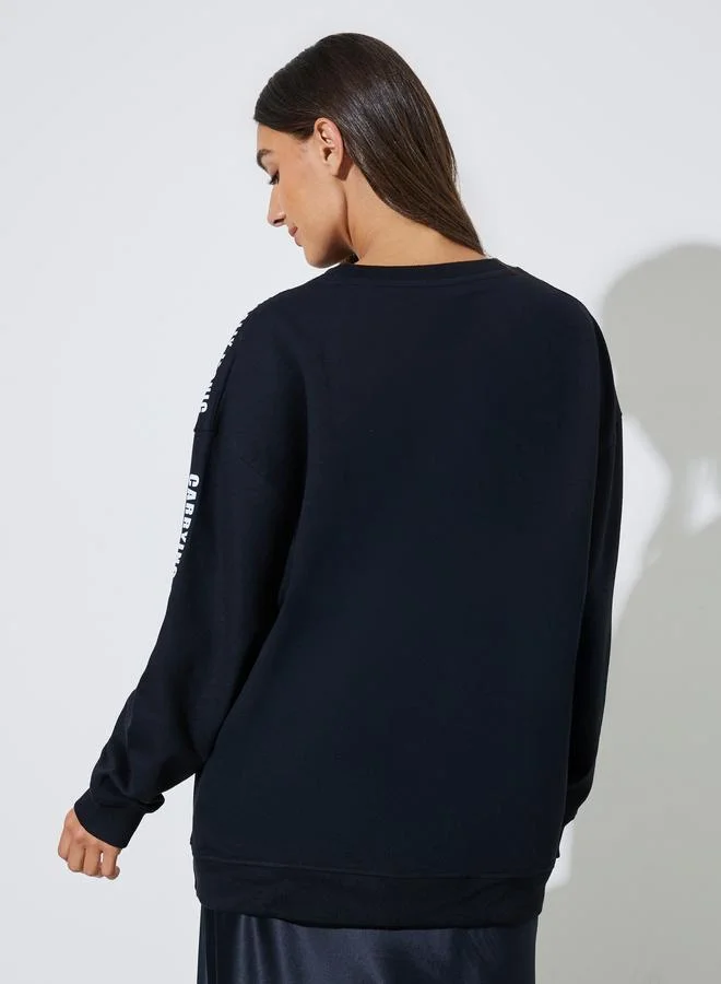 Styli  Black Longline Slogan Sweatshirt for Women | Best Price UAE