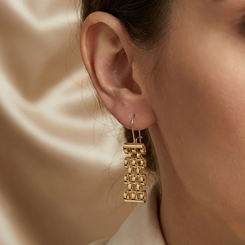 Long gold earrings featuring movable charms that sway with your movement, creating a captivating sparkle. A luxurious and modern piece that will turn heads. - Image 3