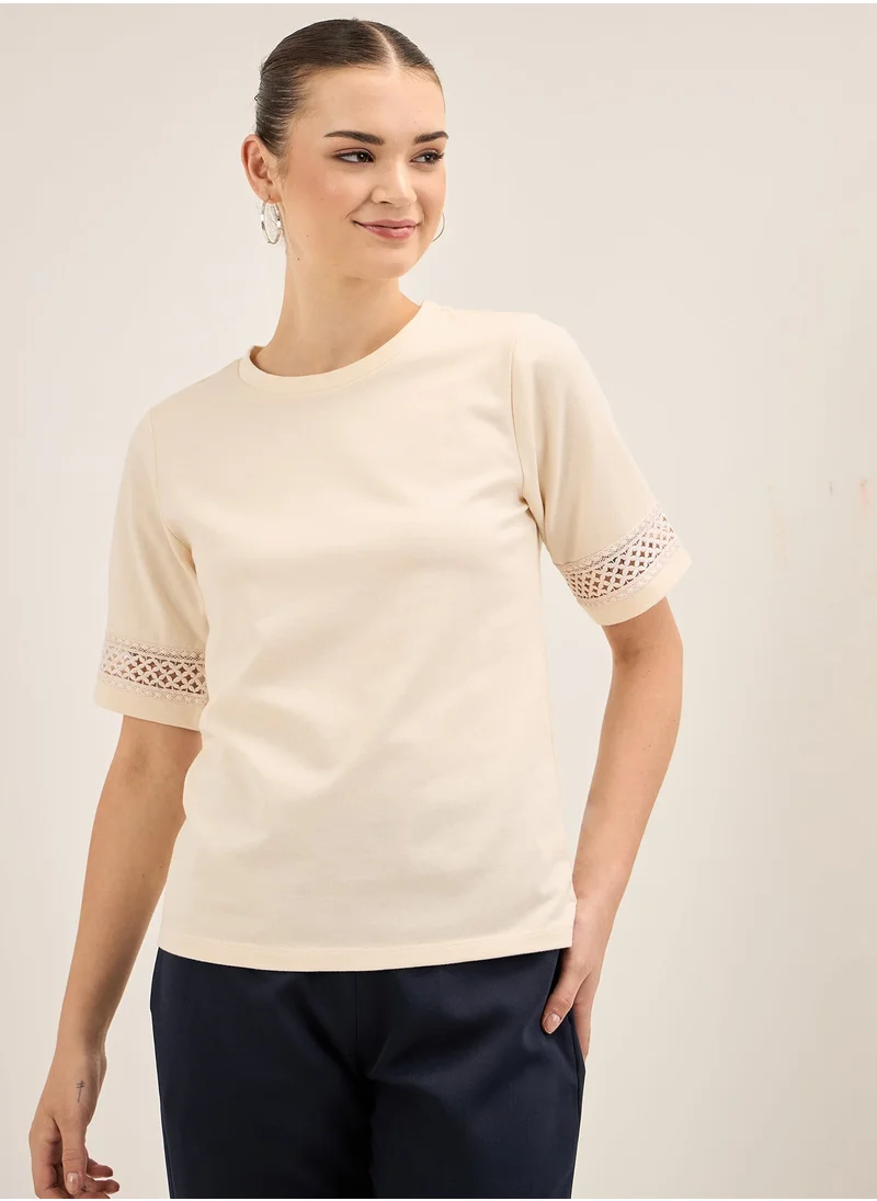 سولت اتاير Elegant Off-White Round Neckline Top with Delicate Lace Insert Detail and Stylish Half Length Sleeves in Regular Fit Perfect for Effortless Sophistication and Versatile Wear Size