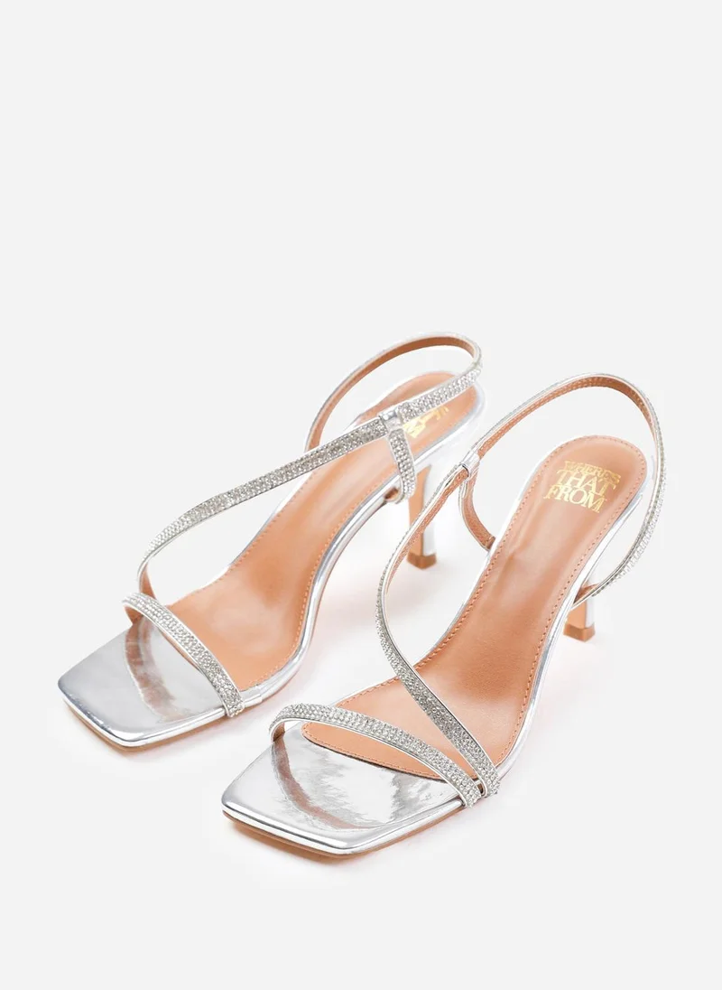 Where's That From Iowa Crystal Cross Foot Strap Mid Heels In Silver Metallic