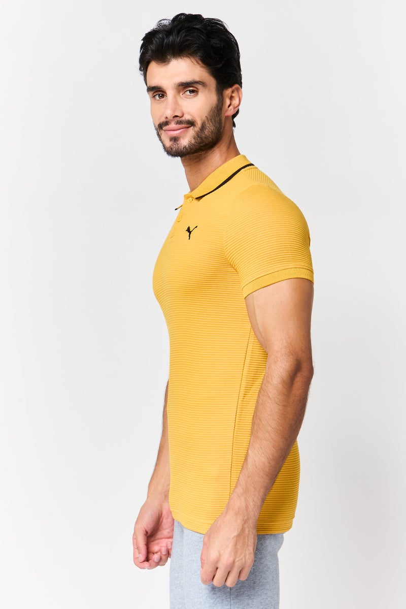 PUMA قميص بولو قصير الأكمام للرجال، رياضي، بتصميم أوتومان، لون خردل - Image 2
