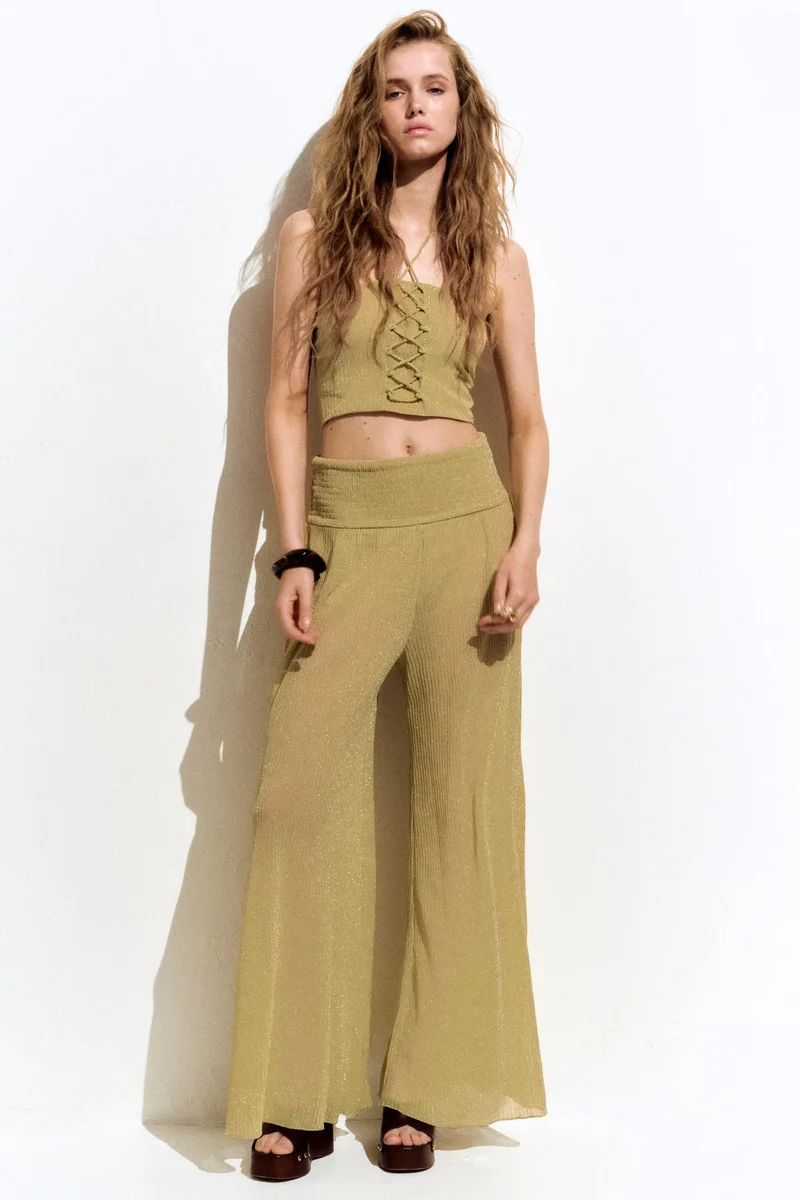 H&M Glittery smocked-waist trousers