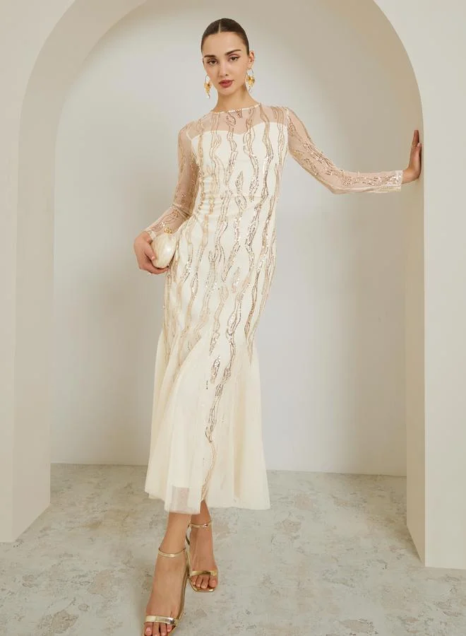 ستايلي فستان طويل من الشبك والترتر