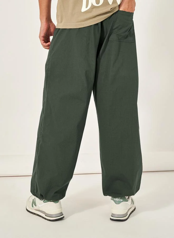 Styli Mid Rise Baggy Parachute Fit Pants
