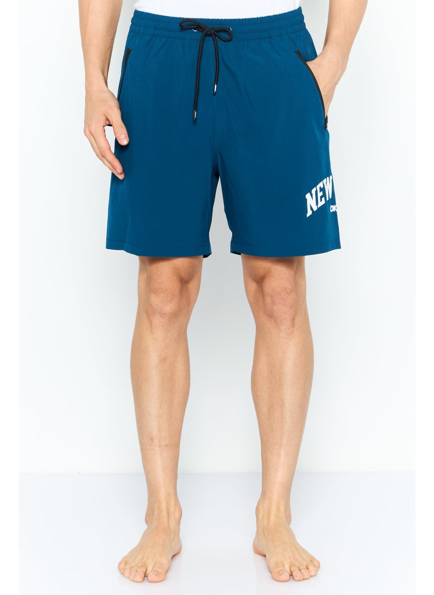 Men Brand Logo Board Shorts, Teal Blue - pzsku/ZBDD3A4B0593299CF82BBZ/45/_/1737642600/ccf6ffe6-18a4-424d-967d-b6d0e9b2def1